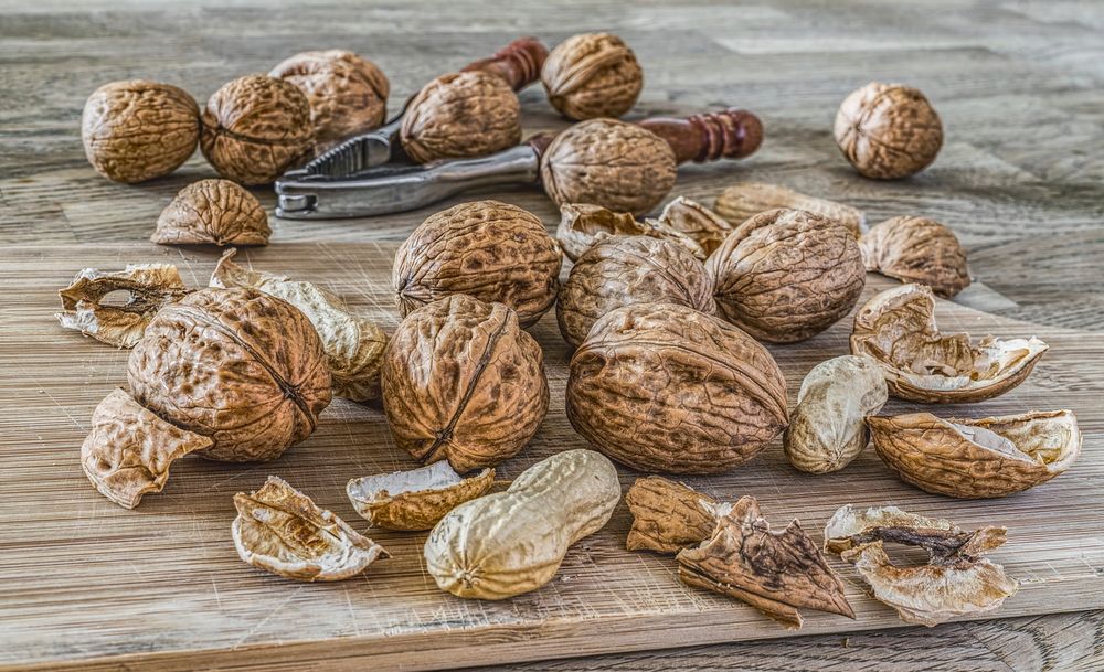 Free close up peanut on wooden board image, public domain vegetable CC0 photo.