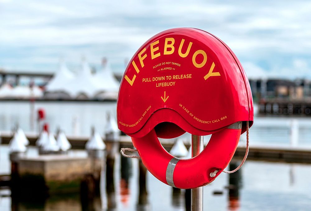 Free lifebuoy by the ocean image, public domain CC0 photo.