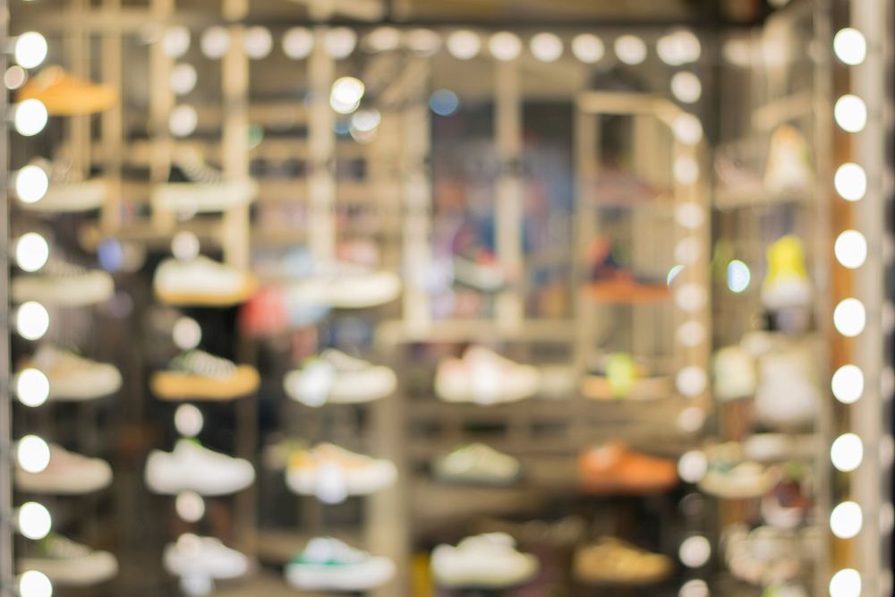 Free blurred shoe shop image, public domain shopping CC0 photo.