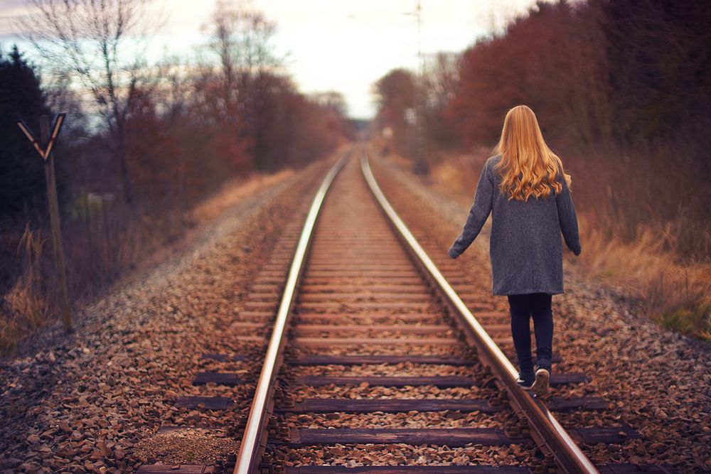 Free woman walking on railway image, public domain CC0 photo.