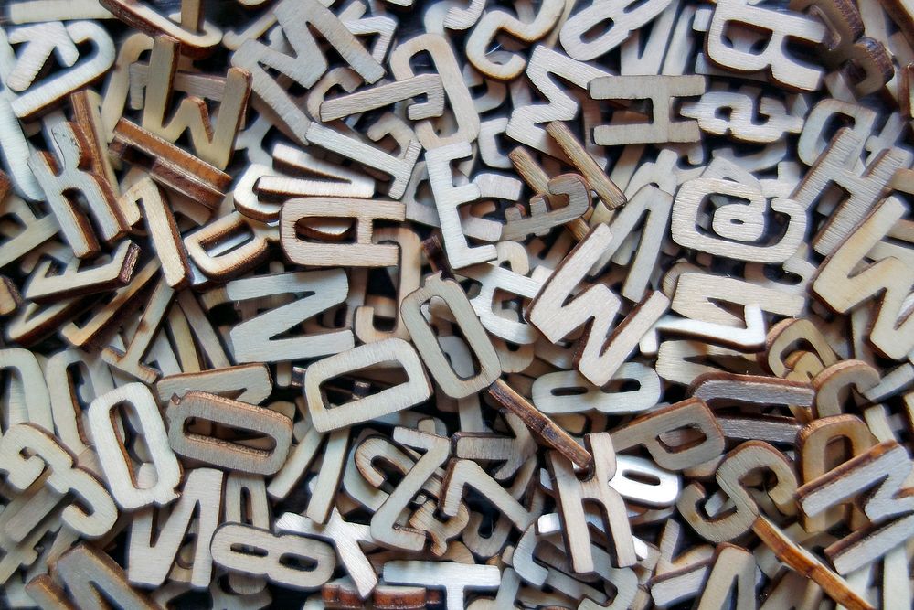 Free pile of wooden letters image, public domain CC0 photo.
