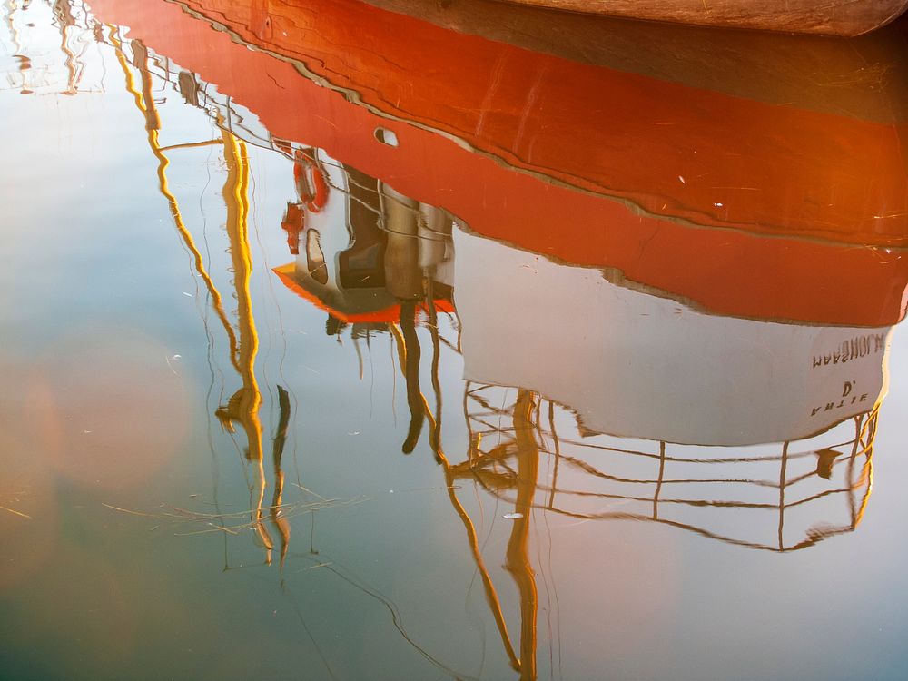 Free reflection of a boat in water image, public domain CC0 photo.