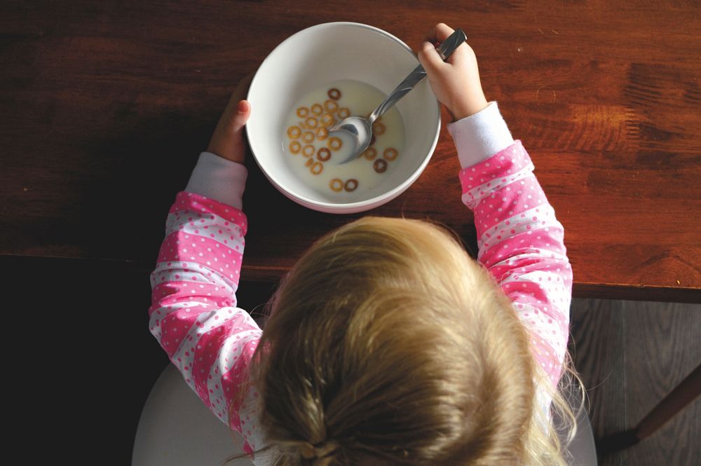 Free kid having cereals image, public domain food CC0 photo.