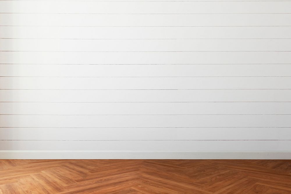 Empty room with white wood paneling wall