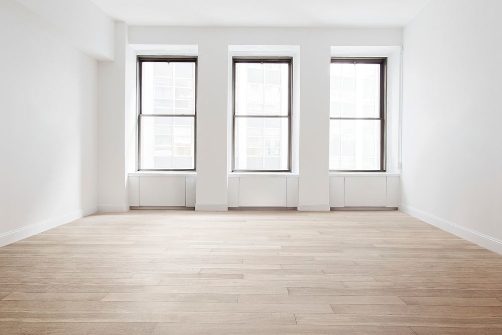 Empty minimal room with windows and natural light