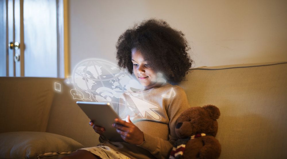 Young black girl using a digital tablet