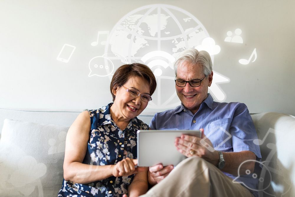 Senior couple browsing the digital tablet together