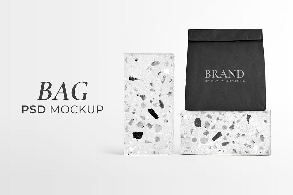 Reusable paper bag mockup psd rolled up in terrazzo pattern