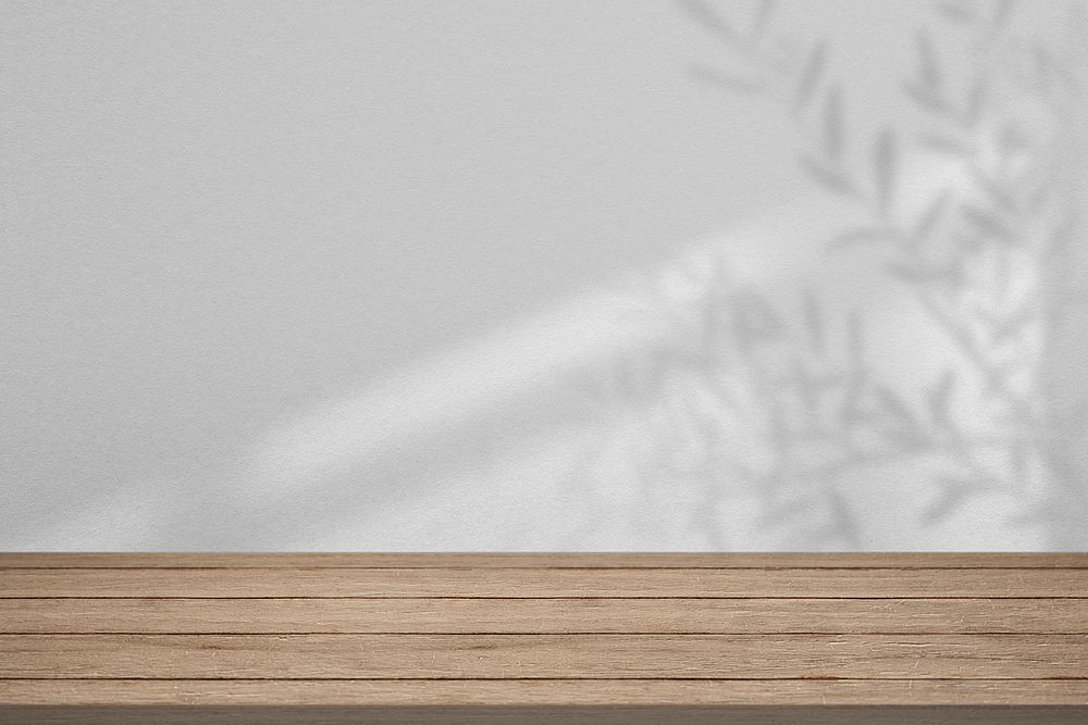 Product backdrop psd mockup, empty wooden floor with leaves leaves shadow