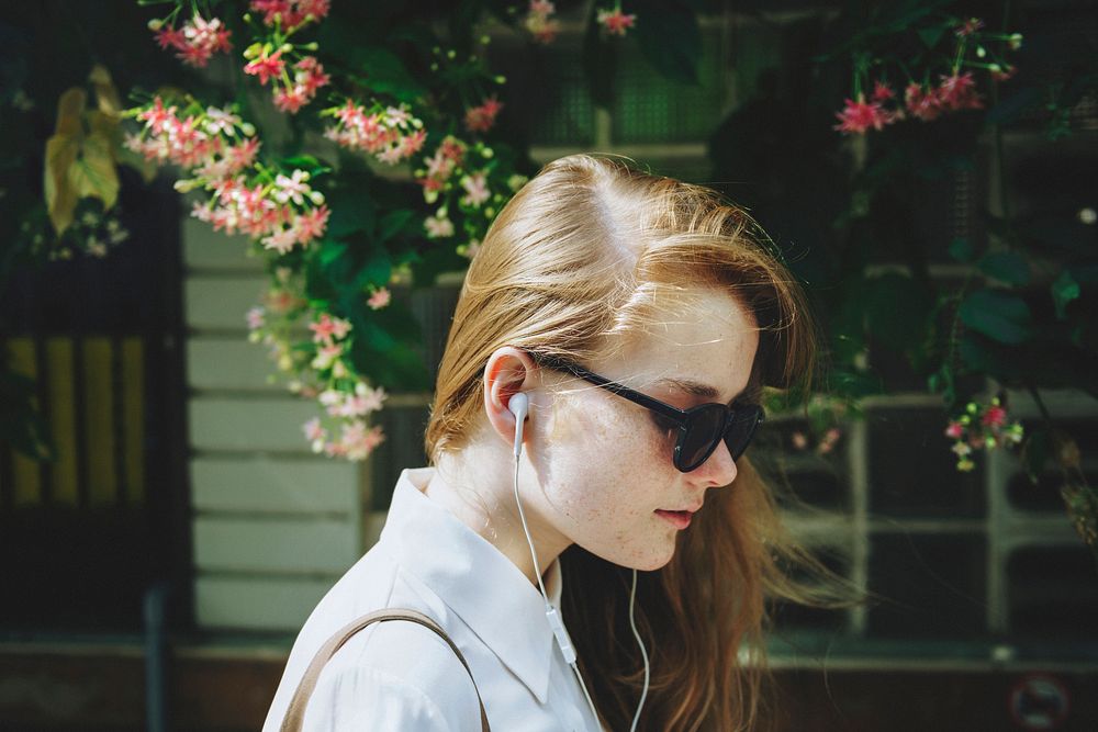 Woman listening to music, white tone filter