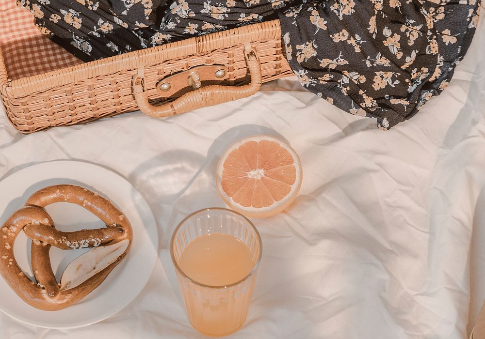 Aesthetic summer picnic, orange juice and pretzels HD photo