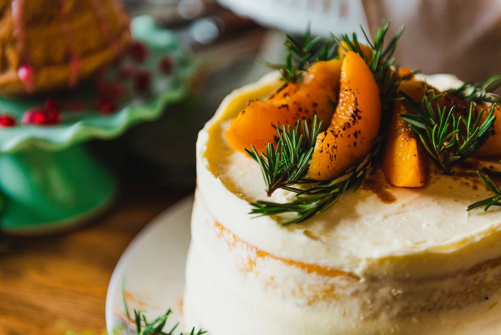 Homemade dessert apricot buttercream cake and rosemary, food photography