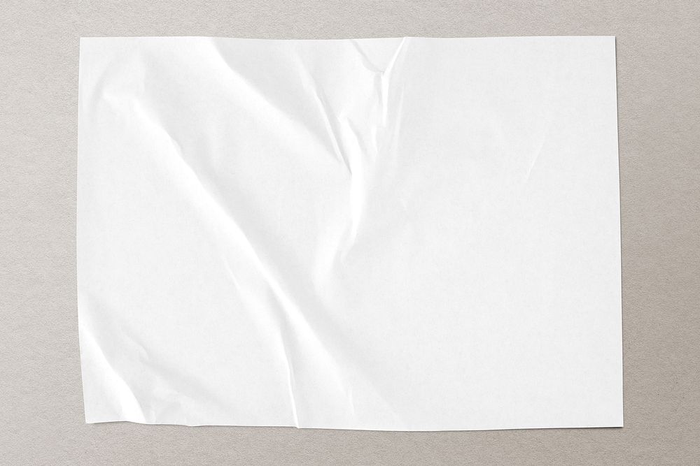 White crinkled paper on gray background