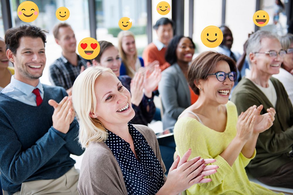 Happy business people applauding in a conference room