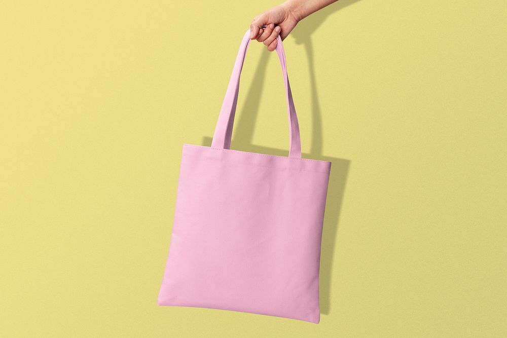 Eco friendly pink tote bag with design space, International Women's Day celebration concept