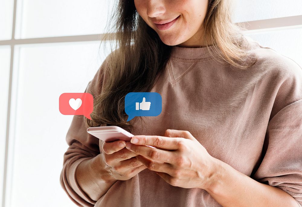 Happy woman using her smartphone