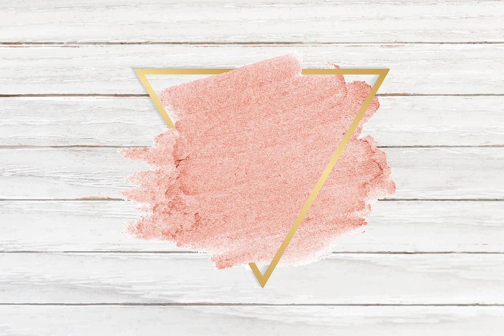 Pastel pink paint with a gold triangle frame on a bleached wood background vector