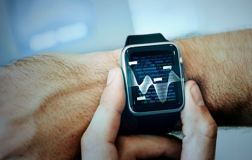 Man checking a summary data on his smartwatch
