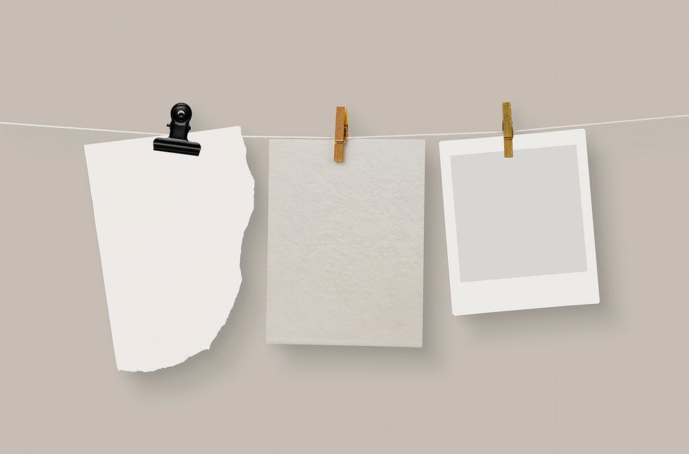 Beige papers & frame, hanging on clothing line