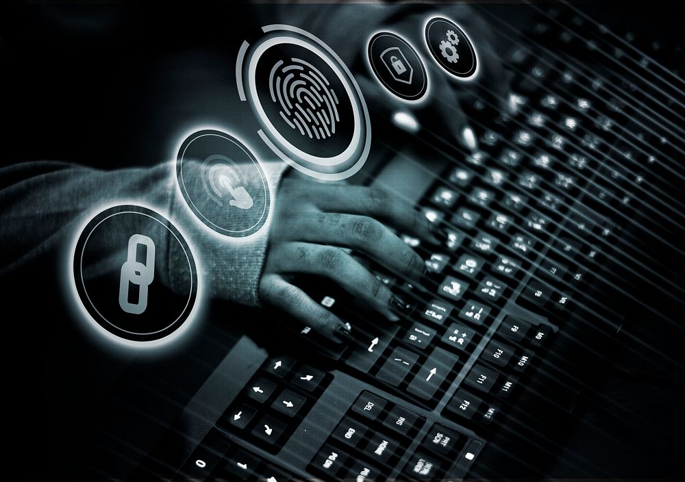 Man cracking the fingerprint scanning system on a laptop