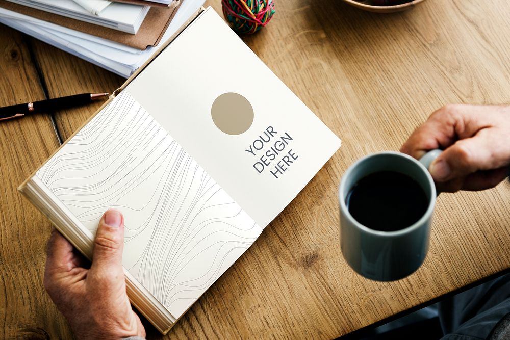 Man having his morning coffee and reading a book mockup