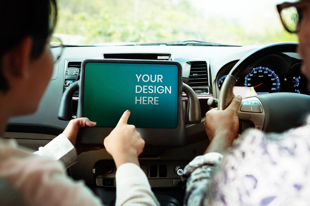 Couple in a car finding direction on a tablet mockup