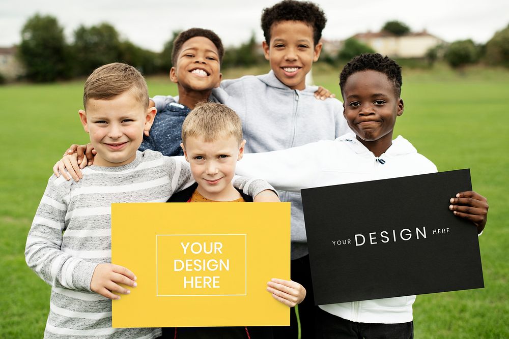 Happy diverse kids holding a sign mockup