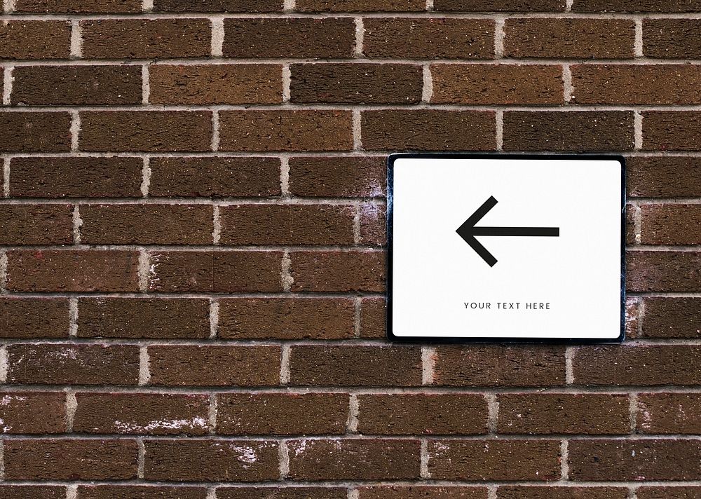 White sign mockup on a brick wall