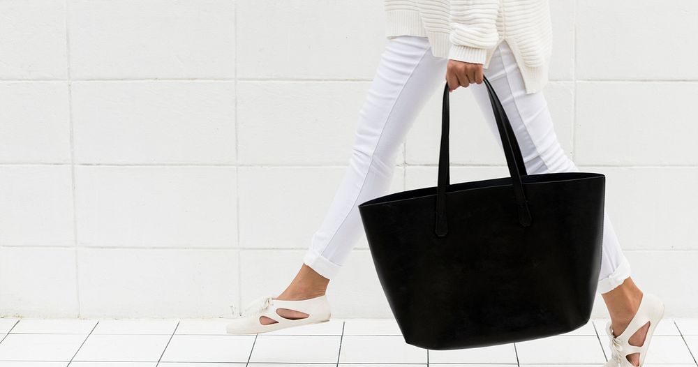 Woman holding a black tote bag mockup website banner template