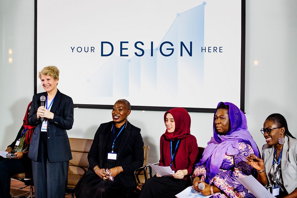 Diverse businesswomen in a conference with a screen mockup