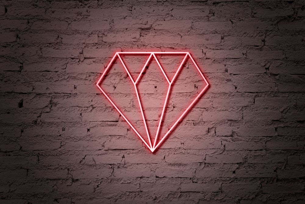 Neon red diamond on brick wall