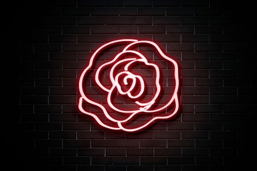 Neon red rose on a wall