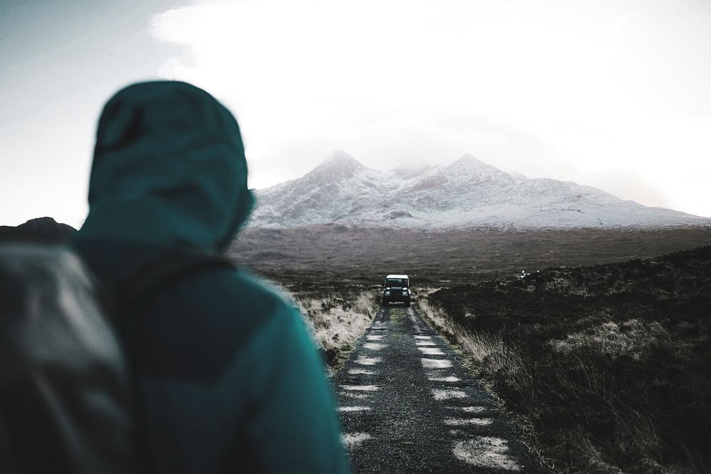 Man walking towards his car at Glen Etive, Scotland