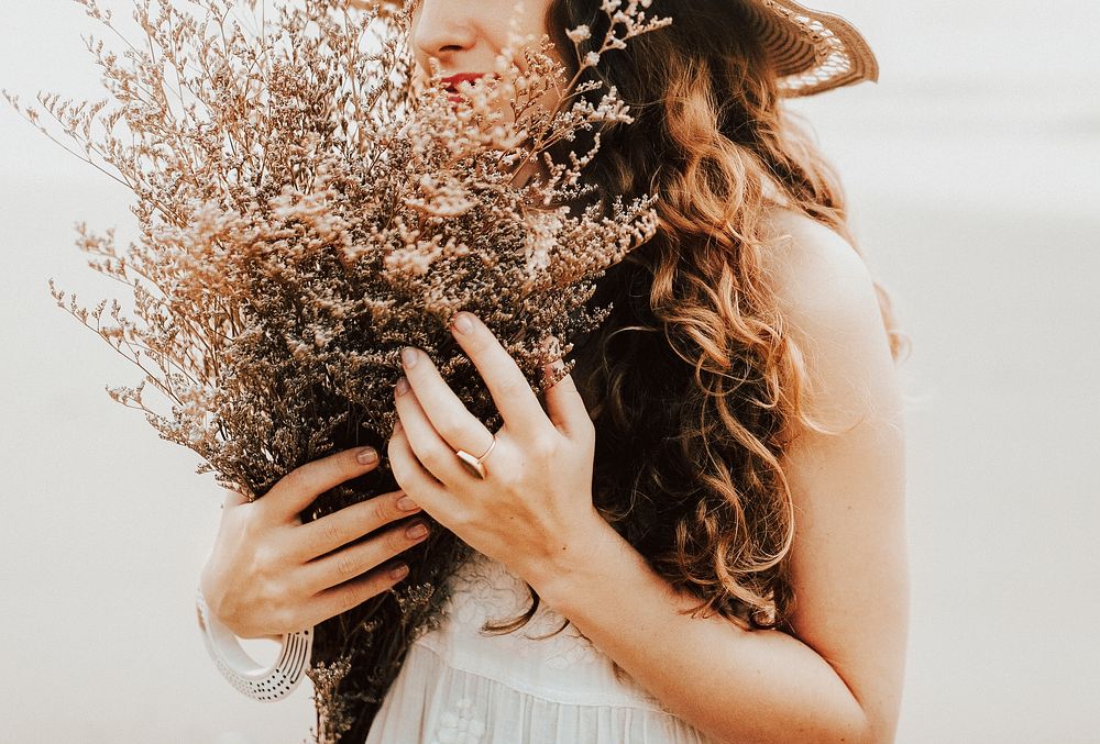 Woman with dried flower bouquet