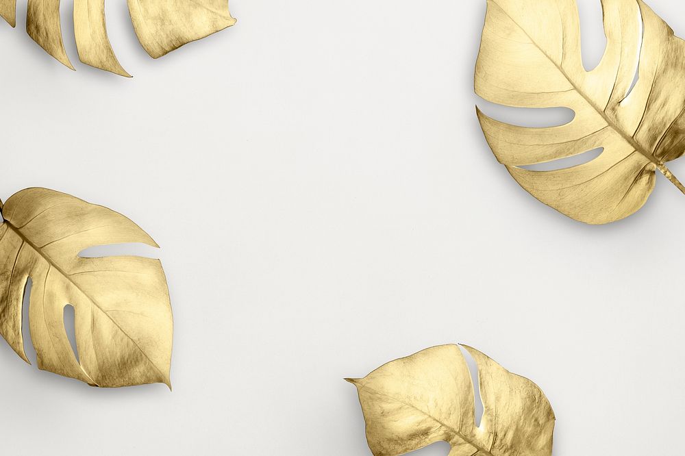 Gold split-leaf philodendron frame on white marble background illustration