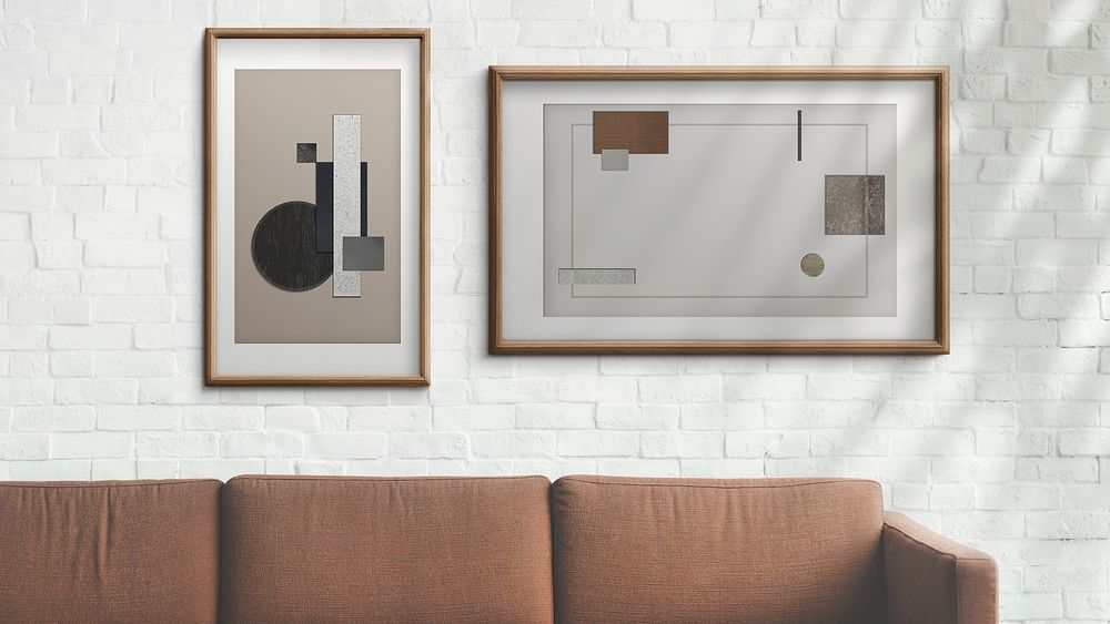 Picture frames hanging on a white brick wall illustration