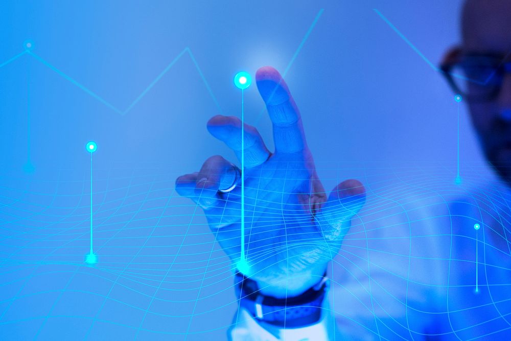 Man touching the futuristic blue screen