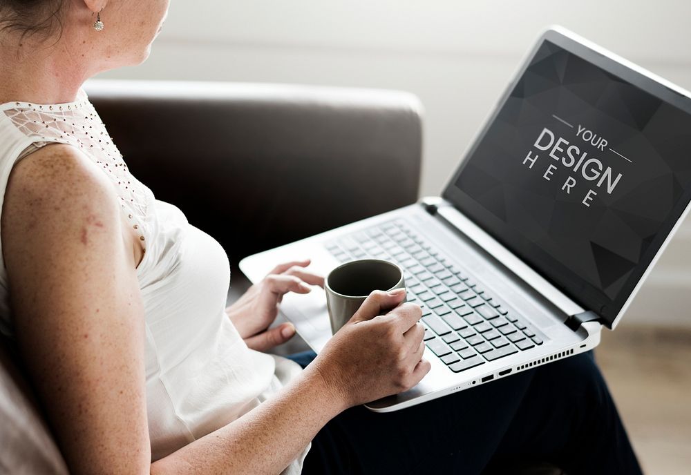 Woman using a laptop screen mockup