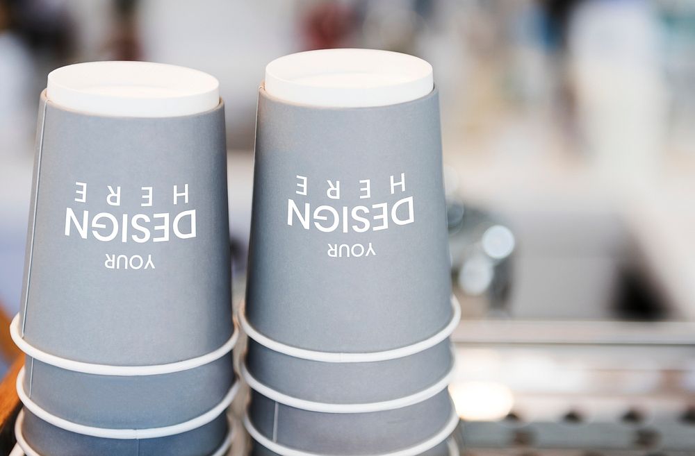 Stacks of coffee paper cup mockups