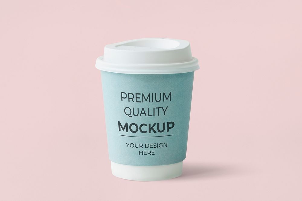 Coffee to go cup with a blue sleeve mockup on a pink background