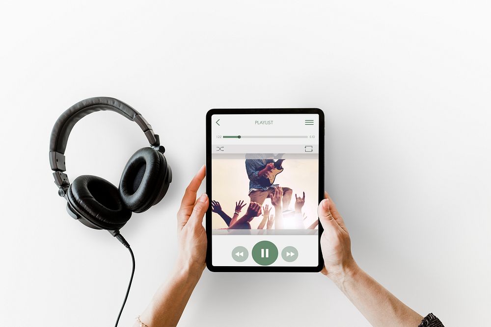 Headphones and music streaming on a tablet mockup