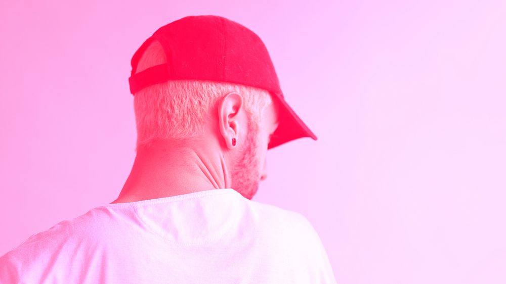 Rearview of a man with a cap with pink effect