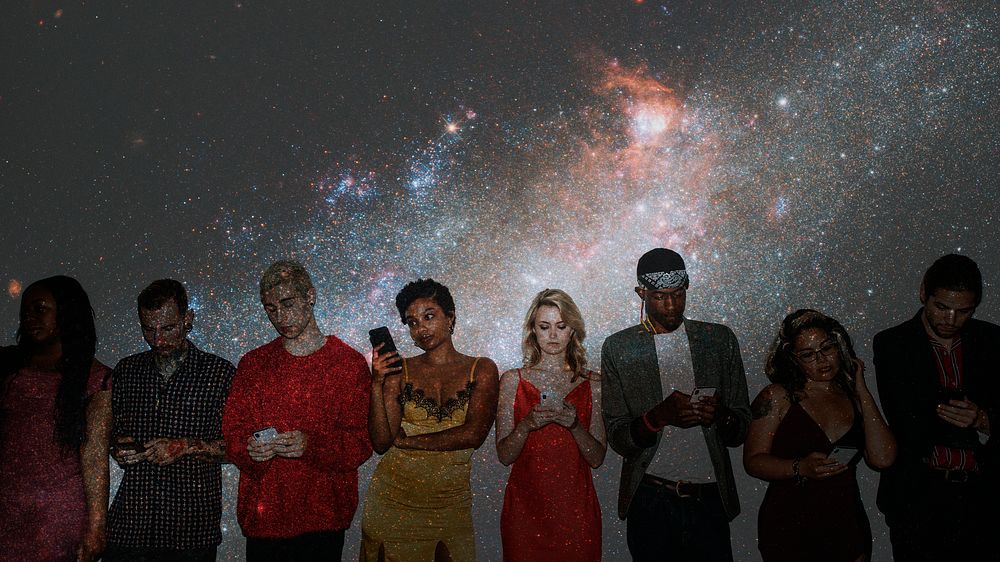 Diverse group of friends standing in a row using their smartphones with cosmos background