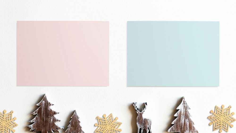 Blank color papers mockup with Christmas decorations on white background