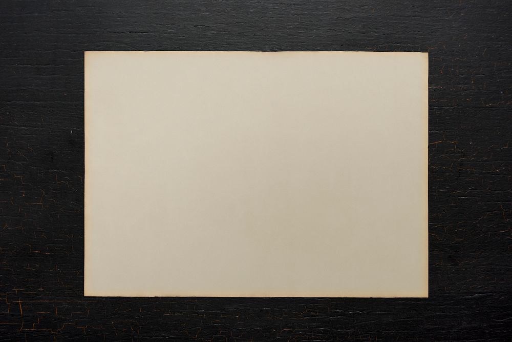 Paper on a black wooden background