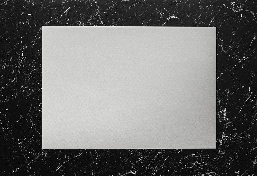 White paper on a marble background