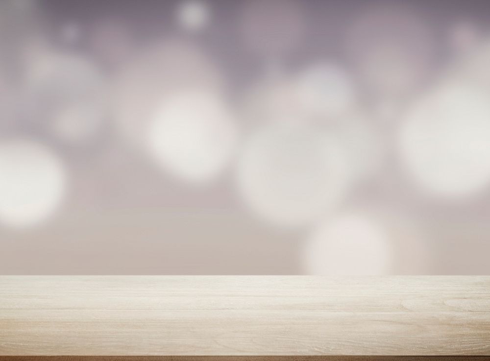Beige wooden plank background with bokeh lights