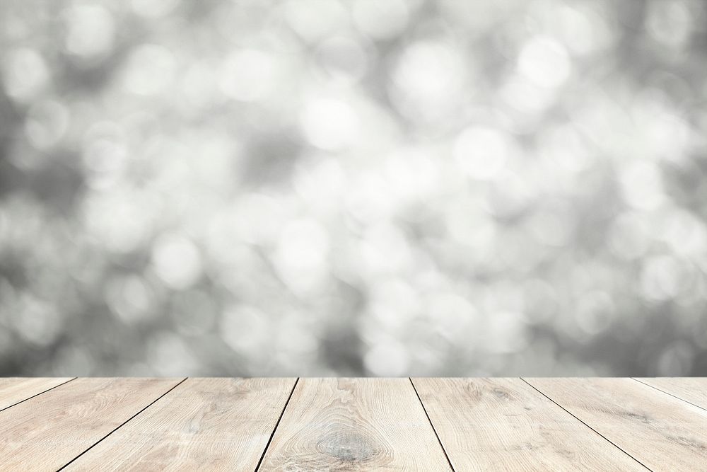 Beige wooden planks with blurry gray lights background