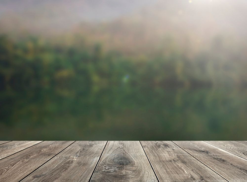 Beige wooden planks with blurred natural background