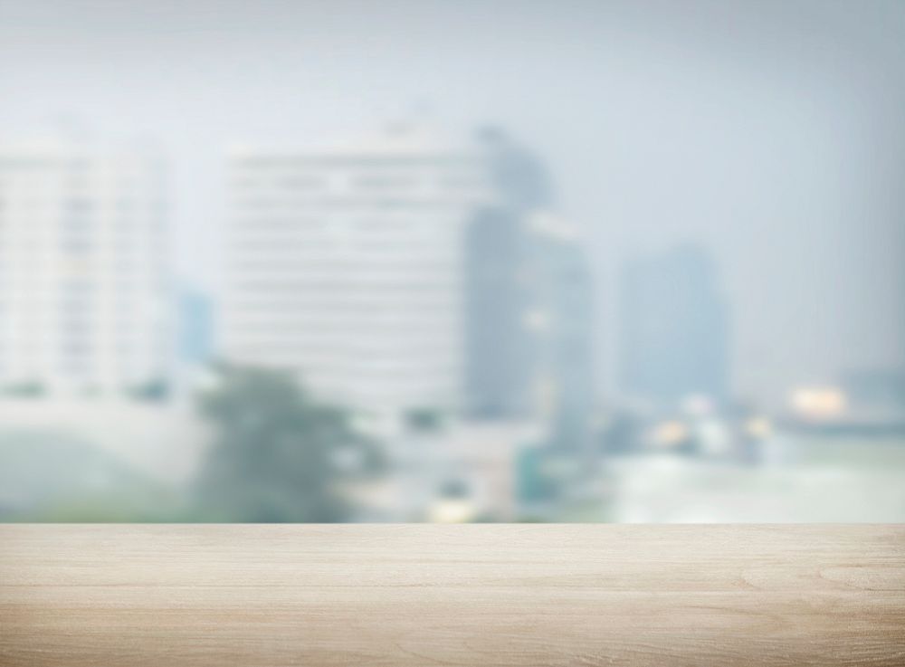 Wooden plank with blurred city view